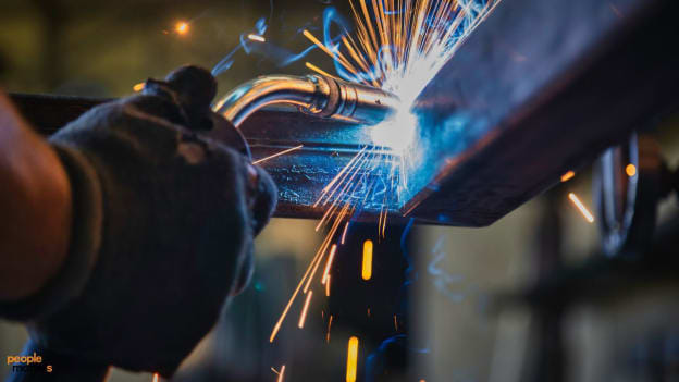 Of bots and bricklayers: AI and blue-collar work